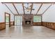 Spacious living room with wood beams, fireplace, and wood paneling at 3156 Laurel Way, Snellville, GA 30078