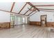 Bright, open living room with beamed ceilings, hardwood floors, and a view of the front entrance at 3156 Laurel Way, Snellville, GA 30078
