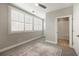 Sunlit bedroom with large windows, ceiling fan, and en suite bathroom at 345 Glen Iris Ne Dr # 5, Atlanta, GA 30312