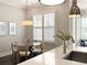 Dining area displaying a modern table setting, bright windows with custom blinds, and hardwood floors at 345 Glen Iris Ne Dr # 5, Atlanta, GA 30312