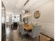 Well-lit dining area featuring stylish lighting, wainscoting, and views of the kitchen at 345 Glen Iris Ne Dr # 5, Atlanta, GA 30312