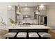 Modern kitchen featuring stainless steel appliances, white backsplash, large island with seating, and pendant lighting at 345 Glen Iris Ne Dr # 5, Atlanta, GA 30312