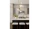 Bright eat-in kitchen with stainless steel appliances, gray cabinets, white subway tile backsplash, and large island at 345 Glen Iris Ne Dr # 5, Atlanta, GA 30312