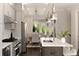 Eat-in kitchen showcasing stainless steel appliances, island with bar seating, pendant lighting, and access to outdoor patio at 345 Glen Iris Ne Dr # 5, Atlanta, GA 30312