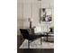 Bright living room boasts modern furniture, abstract art, and grid accent wall at 345 Glen Iris Ne Dr # 5, Atlanta, GA 30312