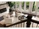 Bright living room with fireplace, comfortable chairs, and large windows at 345 Glen Iris Ne Dr # 5, Atlanta, GA 30312