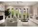 Elegant living room with French doors offering scenic outdoor views and natural light at 345 Glen Iris Ne Dr # 5, Atlanta, GA 30312
