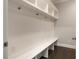 Hall tree-style mudroom includes a bench, coat hooks, and built-in cubbies for storage at 345 Glen Iris Ne Dr # 5, Atlanta, GA 30312