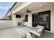 Outdoor living space with a fireplace, fan, and comfortable seating at 345 Glen Iris Ne Dr # 5, Atlanta, GA 30312