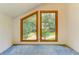 Cozy attic featuring unique windows with view of trees at 4920 Tremont Ne Dr, Marietta, GA 30066