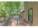 Backyard featuring a patio and lush landscaping and stone wall at 4920 Tremont Ne Dr, Marietta, GA 30066