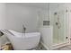 Bathroom featuring a freestanding tub, glass-enclosed shower, and modern design at 4920 Tremont Ne Dr, Marietta, GA 30066