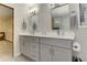 Bathroom showcasing a double vanity with grey cabinets and light countertops at 4920 Tremont Ne Dr, Marietta, GA 30066