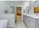 Bathroom featuring modern updates including vanity, soaking tub, and glass enclosed shower at 4920 Tremont Ne Dr, Marietta, GA 30066