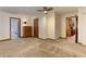 Neutral bedroom with a ceiling fan, and doors to the bathroom and kitchen at 4920 Tremont Ne Dr, Marietta, GA 30066