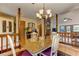 Open dining room adjacent to the living room, featuring a chandelier and seating for four at 4920 Tremont Ne Dr, Marietta, GA 30066