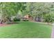 Beautiful property with a two-car garage, mature trees, and an expansive front lawn at 4920 Tremont Ne Dr, Marietta, GA 30066