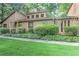 Landscaped front yard with mature shrubs and a walkway leading to the entrance at 4920 Tremont Ne Dr, Marietta, GA 30066