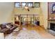 Open-concept living space with hardwood floors, stone fireplace, and views to dining and kitchen at 4920 Tremont Ne Dr, Marietta, GA 30066