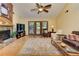 Spacious living room with a stone fireplace, wooden accents, and lots of natural light at 4920 Tremont Ne Dr, Marietta, GA 30066
