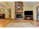 Cozy living room featuring a fireplace, a piano, and access to other areas of the home at 4920 Tremont Ne Dr, Marietta, GA 30066