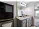 Well-lit bathroom featuring double granite sink vanity and ample storage space at 1005 Bayrose Cir # 5A, Atlanta, GA 30344