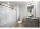 Bright bathroom featuring a shower-tub combo, granite vanity, and neutral color palette at 1005 Bayrose Cir # 5A, Atlanta, GA 30344