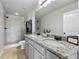 Bright bathroom featuring double sink vanity with granite counter and walk-in shower at 1005 Bayrose Cir # 5A, Atlanta, GA 30344