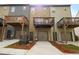 Three-story townhomes with elevated decks and attached garages at 1005 Bayrose Cir # 5A, Atlanta, GA 30344
