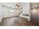 Inviting living room featuring sleek fireplace, hardwood flooring, and bright entry door at 1005 Bayrose Cir # 5A, Atlanta, GA 30344