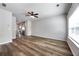 Bright living area with hardwood floors, fan and view into kitchen, creating an inviting space at 1005 Bayrose Cir # 5A, Atlanta, GA 30344