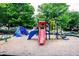 Community playground featuring colorful climbing structures and slides in a well-maintained, wooded neighborhood setting at 1005 Bayrose Cir # 5A, Atlanta, GA 30344