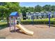 Community playground featuring a slide and swings, located near modern townhomes, offers convenient recreation at 1005 Bayrose Cir # 5A, Atlanta, GA 30344