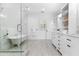 Modern bathroom featuring a glass shower, soaking tub, double vanity and plenty of natural light at 1658 E Clifton Ne Rd, Atlanta, GA 30307