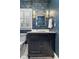 Elegant bathroom with blue wallpaper, designer mirror, and attractive lighting at 1658 E Clifton Ne Rd, Atlanta, GA 30307