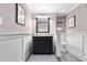 Charming bathroom features wainscoting, a vanity with storage, and a well-lit mirror for convenience at 1658 E Clifton Ne Rd, Atlanta, GA 30307