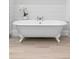 Freestanding bathtub with elegant claw feet, set against a backdrop of shiplap walls at 1658 E Clifton Ne Rd, Atlanta, GA 30307