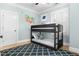 bedroom with bunkbeds, a colorful map mural, and plenty of natural light at 1658 E Clifton Ne Rd, Atlanta, GA 30307