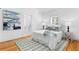 Bright bedroom featuring hardwood floors, white walls, and comfortable bed at 1658 E Clifton Ne Rd, Atlanta, GA 30307