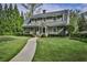 Charming two-story home with landscaped yard, walkway, and inviting front porch with rocking chairs at 1658 E Clifton Ne Rd, Atlanta, GA 30307