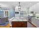Bright kitchen with white cabinets, marble countertops, stainless steel appliances, and a central island at 1658 E Clifton Ne Rd, Atlanta, GA 30307