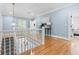 Upstairs landing featuring hardwood floors, and a beautiful view of the front staircase at 1658 E Clifton Ne Rd, Atlanta, GA 30307