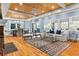 Spacious living room with hardwood floors, ample natural light, and seamless access to the dining area and outdoor patio at 1658 E Clifton Ne Rd, Atlanta, GA 30307