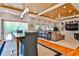 Open-concept living and dining area with hardwood floors, built-in shelves, and access to an outdoor space at 1658 E Clifton Ne Rd, Atlanta, GA 30307