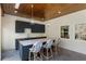 Outdoor bar area with dark cabinets, marble countertop, and stylish seating, perfect for entertaining and enjoying the outdoors at 1658 E Clifton Ne Rd, Atlanta, GA 30307