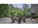 Enjoy outdoor living on the flagstone patio, featuring a fire pit and comfortable seating area at 1658 E Clifton Ne Rd, Atlanta, GA 30307