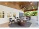 Covered porch featuring a stone floor, ceiling fans and comfortable seating at 1658 E Clifton Ne Rd, Atlanta, GA 30307