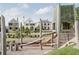 A modern community playground with wooden structures and ample green space for play at 190 Rolison Way, Fayetteville, GA 30214