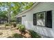 Charming home exterior with well-maintained landscaping and a pathway at 881 Mclinden Se Ave, Smyrna, GA 30080