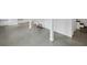 Spacious basement with concrete floors, white-painted brick walls, and supporting columns at 881 Mclinden Se Ave, Smyrna, GA 30080